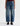 A woman wearing high rise barrel jeans in medium wash with a short sleeve maroon tee and black loafers on a white background.
