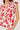 Red floral patterned top on a white background