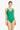 Woman wearing a green swimsuit on a white background