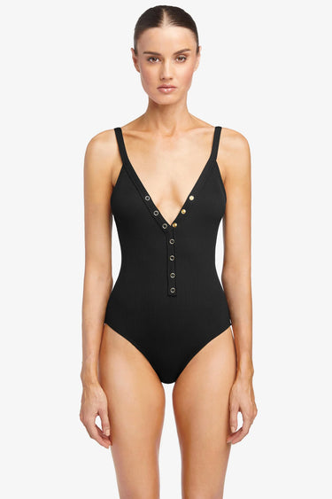Black swimsuit with button details on a white background