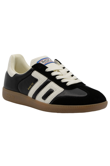 A low-top sneaker featuring a black suede upper with textured white side stripes, white laces, a cream collar lining, and a brown gum sole.