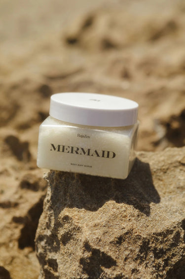 body scrub jar on a beach landscape