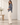 Side view of Bella Dahl Seamed Button Down Shirt showing its relaxed fit and curved shirttail hem