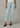 A woman wearing high rise cropped jeans