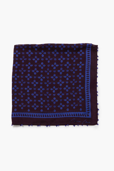 Navy bandana folded into a square with blue pattern on a white background