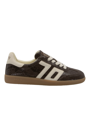 A single low-top sneaker shown in profile against a plain white background. The shoe features a dark brown snakeskin patterned upper, cream-colored side stripes and heel tab, white laces, and a brown gum sole.