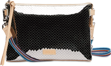 Black and white patterned handbag with a strap on a white background