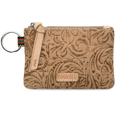 A tan tooled leather wristlet pouch with a matching leather key ring and strap, featuring a colorful woven accent strip and a 'CONSUELA' brand patch on a white background.