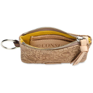 A small tan embossed leather key pouch with a silver zipper, shown open to reveal a yellow interior lining and a branded card slot. A metal key ring is attached on the left, and a tan leather pull tab hangs from the zipper on the right.