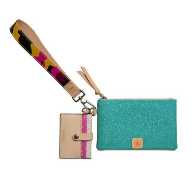 A turquoise glitter zip pouch with a tan leather logo patch, shown with a matching beige wristlet strap and a small beige card holder charm on a white background.