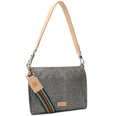 A shoulder bag with a gray and black leopard print pattern, featuring a light tan leather strap and a colorful rainbow-striped elastic band across the front.