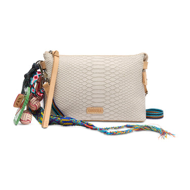 Beige textured handbag with colorful strap and decorative elements on a white background
