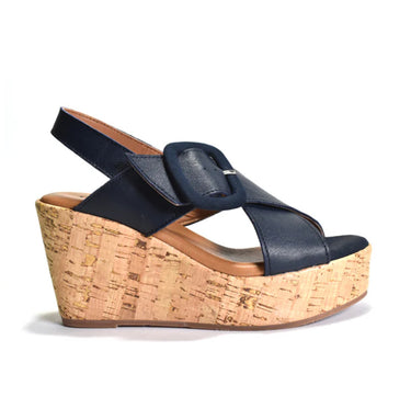 Navy wedge sandal with cork wedge sole on a white background