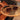 Sunglasses on a wicker chair with a blurred background