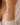a woman wearing a oval silver and circle gold beaded bracelet