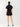 Person wearing a black outfit on a white background