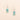 Pair of earrings with rectangular design on a beige background