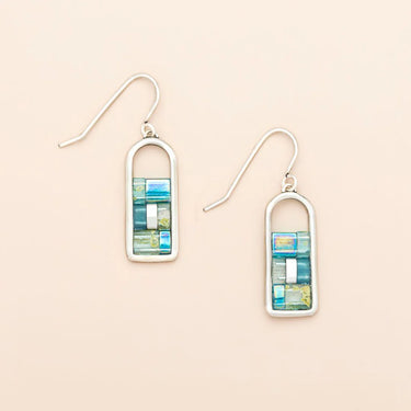 Pair of earrings with rectangular design on a beige background