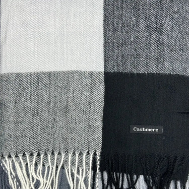 a close up of a plaid pashmina