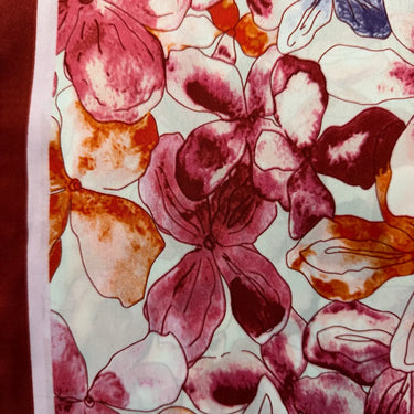 A burgundy floral printed scarf