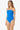 Woman wearing a blue strapless swimsuit on a white background