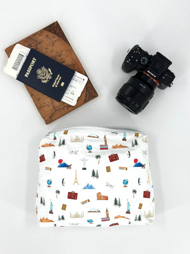 A medium white zipper pouch with world landmarks on it