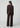 Chocolate brown button-front cardigan styled with matching wide-leg velvet pants and pointed-toe shoes on a model.