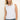 Woman wearing a white sleeveless top against a plain background