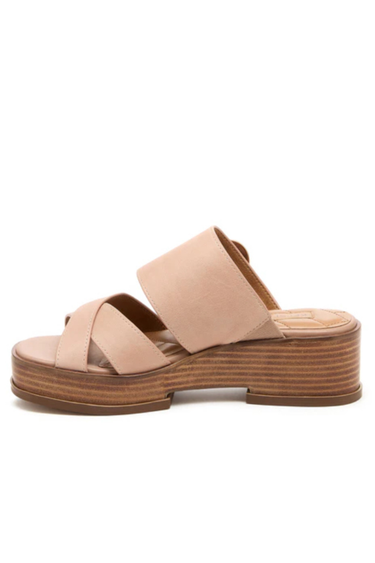 Light pink sandal with wooden sole on a white background