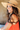 A woman wearing a natural wide brim sun hat