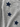 Close-up of a heather gray fabric garment with three dark navy blue embroidered star patches, each decorated with small rhinestones.