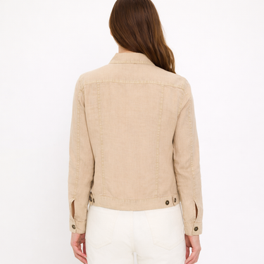 Beige jacket worn by a person on a white background