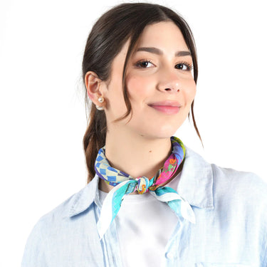 Woman wearing a colorful scarf around her neck on a white background