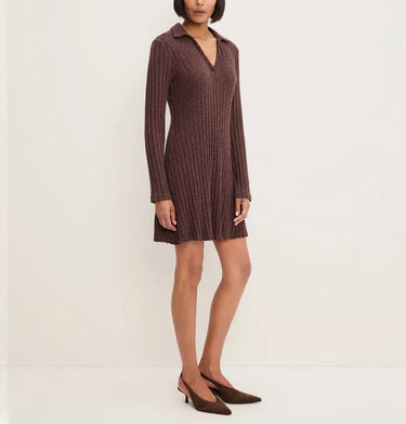 A woman models a ribbed knit mini dress in a dusty rose-brown color, paired with matching pointed-toe heels, against a plain off-white studio background.