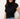 A woman wearing a fitted black short-sleeve mock neck top with ruching at the sides, paired with blue jeans, against a plain off-white background.