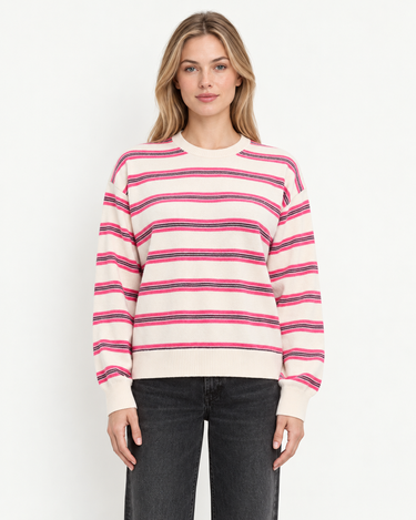 A woman wearing a cashmere beige pink-striped sweater on a white background.