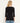 Person wearing a black long-sleeve top and blue jeans on a white background