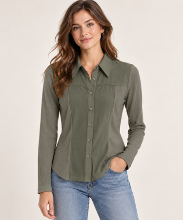 A woman modeling a long-sleeve button-up shirt in olive green, paired with blue jeans, against a plain light beige studio background.