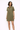 Woman wearing a green dress on a white background