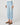 Light blue cropped straight jeans worn by a person on a white background