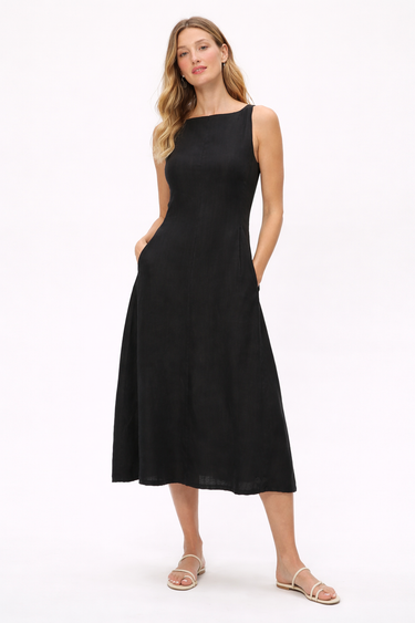 Woman wearing a black sleeveless dress on a white background