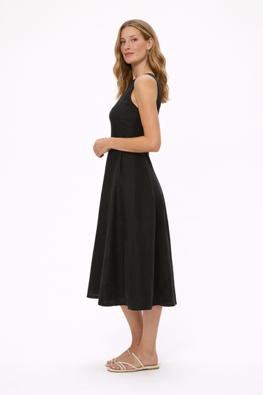 Woman wearing a black sleeveless dress on a white background