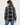 a woman wearing a black and ivory plaid collared shirt and blue jeans on a white background.