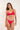 Woman wearing a red bikini set on a white background