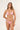 Woman wearing a red and white floral bikini against a plain background