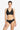 Woman wearing a black bikini with gold accents on a white background