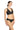 Woman wearing a black bikini with gold buttons on a white background