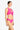 Woman wearing a pink bikini set on a white background