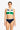 Woman wearing a colorful bikini set on a white background