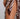 Close-up of a patterned garment with fringes on a plain background